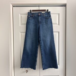 AG Adriano Goldschmied Saige Raw Hem Wide Leg Mid Rise Cotton Denim Jeans.